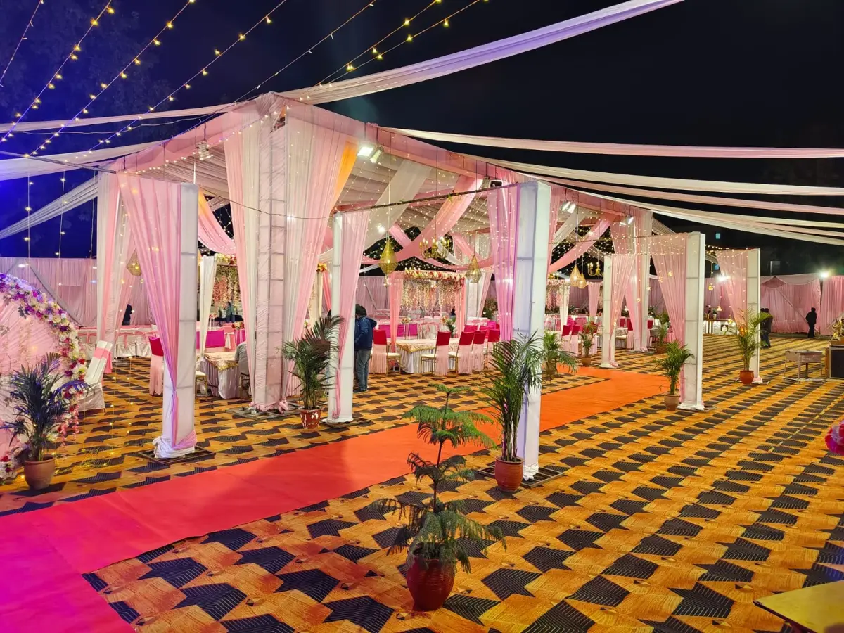 Our own tent setup for a wedding in Chandigarh — draped marquee, string lighting and carpeted flooring by Sandeep Tent & Catering